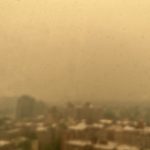 a city skyline seen through hazy air