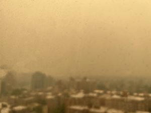 a city skyline seen through hazy air
