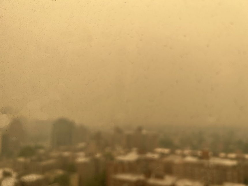 a city skyline seen through hazy air