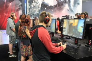 Gamers playing video games at a gaming event