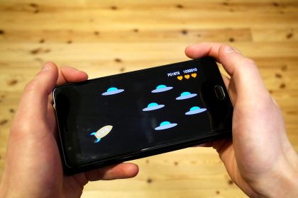 A person playing a game on a smartphone