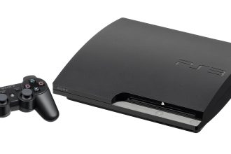 A PlayStation console with its wireless controller